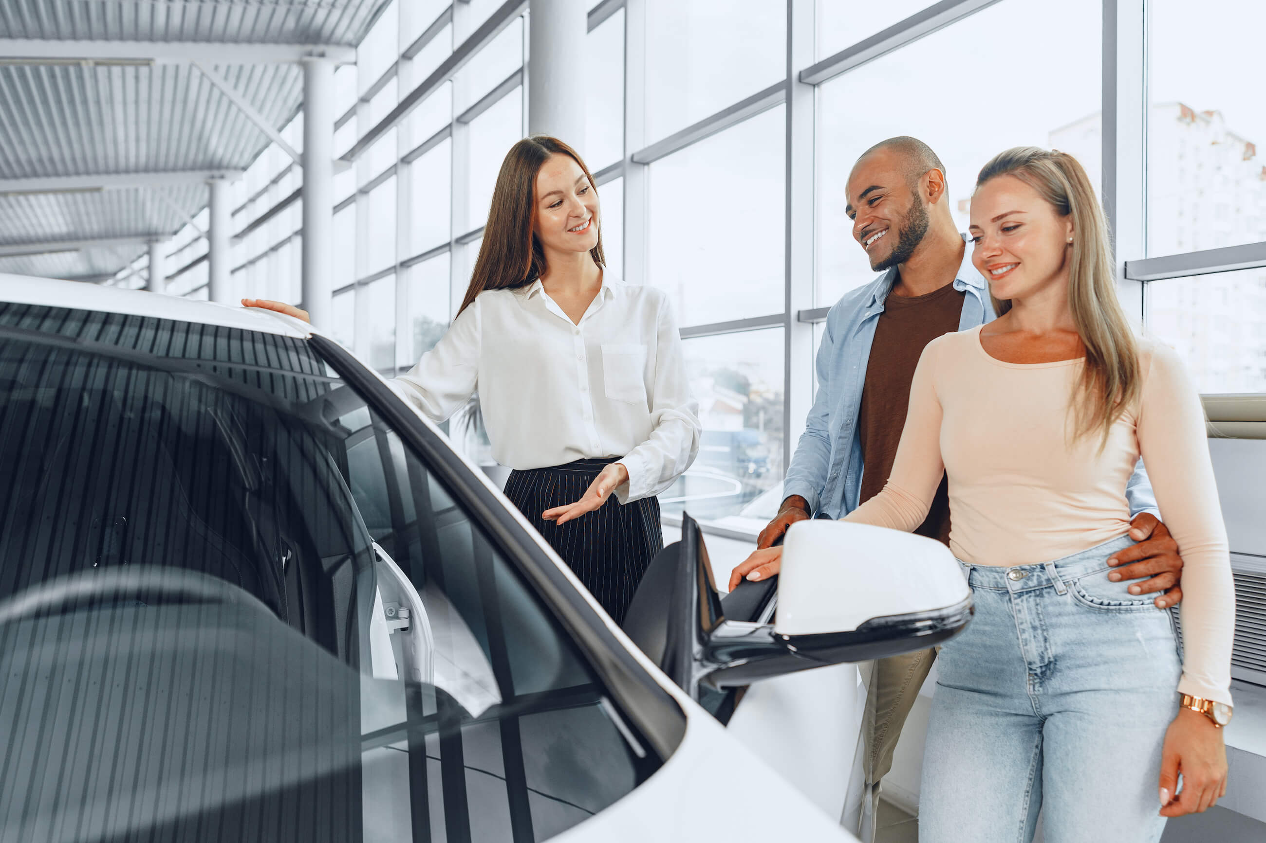 Purchasing a car at a dealership | Featured image for the Should I Buy from a Dealer or Private Seller Blog from Fido Finance.