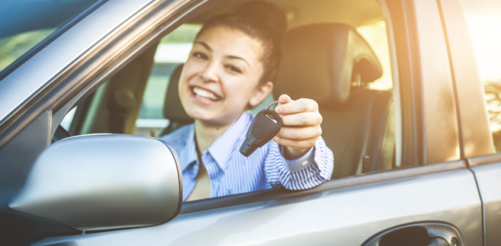 Young Girl Holding Keys | Featured image for the First Time Car Buyer Guide Blog from Fido Finance.