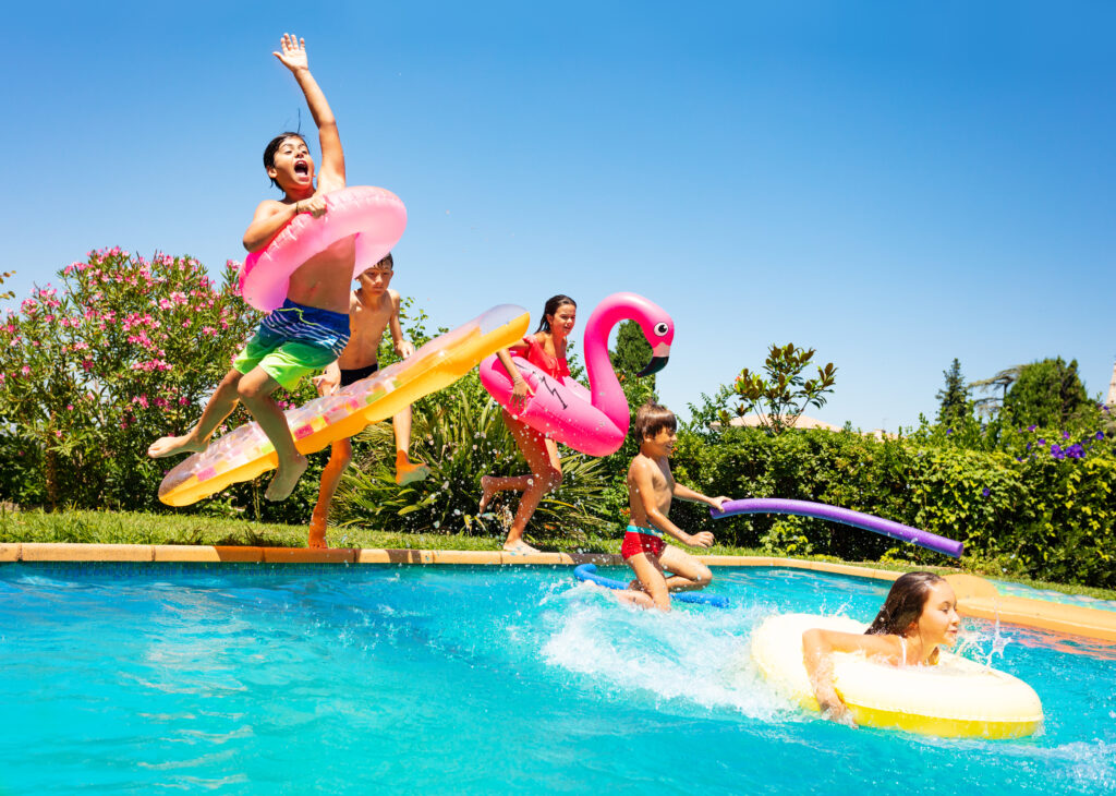 Happy Friends Jumping In a Pool at home